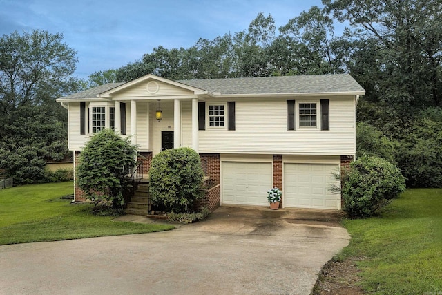 raised ranch with a front yard and a garage