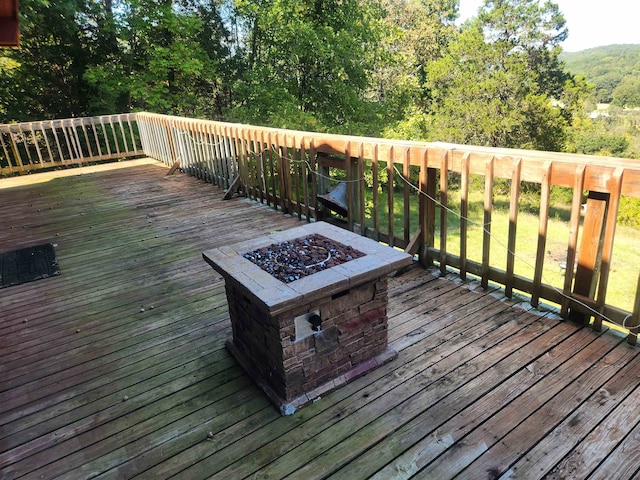 deck featuring an outdoor fire pit