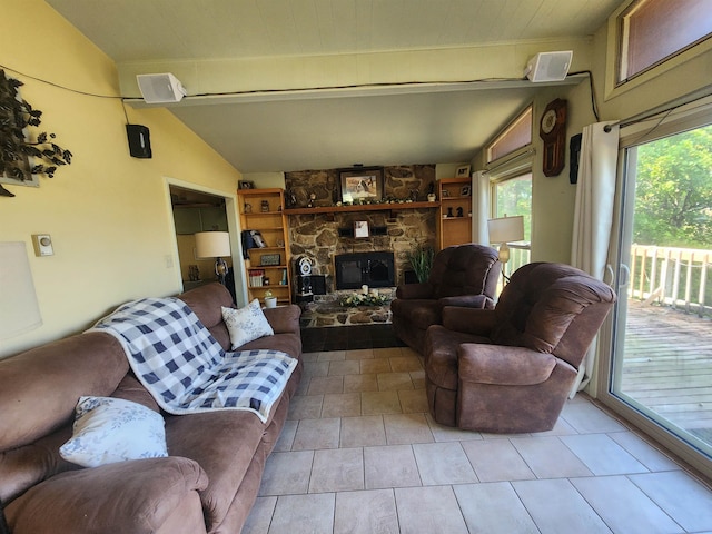 tiled living room featuring a fireplace, lofted ceiling with beams, and built in features