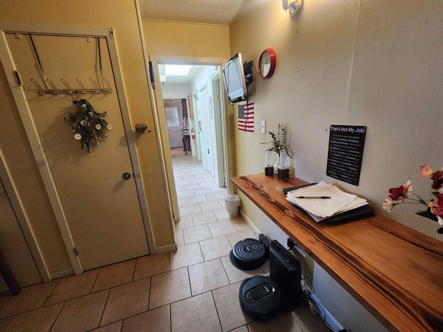 corridor with light tile patterned floors