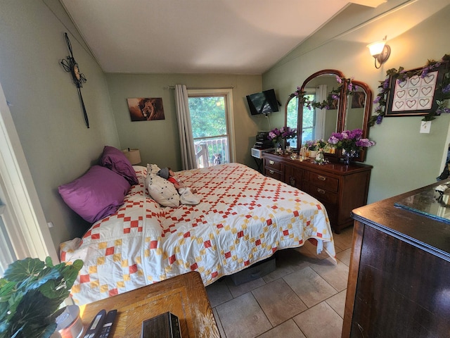 bedroom featuring vaulted ceiling