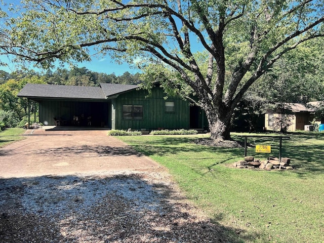 236 N Riverview Ln, Mountain View, AR 72560 - view of green lawn featuring concrete driveway and an attached carport