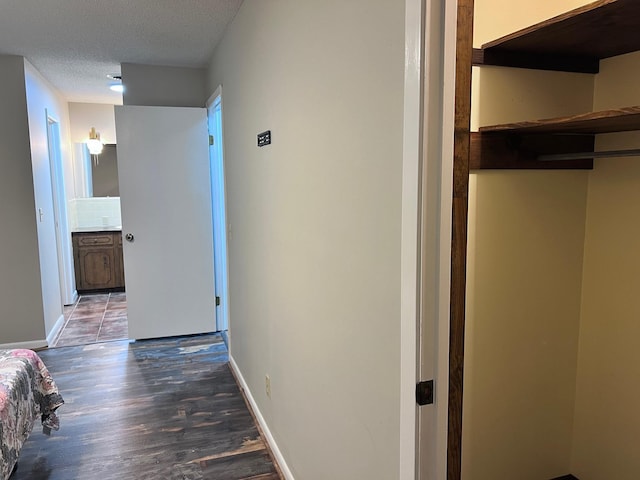 236 N Riverview Ln, Mountain View, AR 72560 - corridor with wood finished floors, baseboards, and a textured ceiling