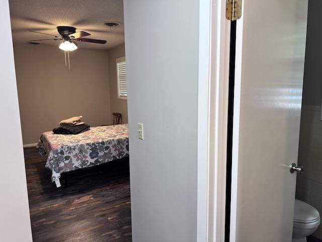 236 N Riverview Ln, Mountain View, AR 72560 - bedroom with dark wood-style floors, ceiling fan, and baseboards