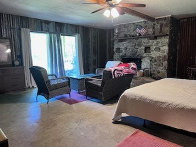 236 N Riverview Ln, Mountain View, AR 72560 - bedroom with a fireplace and a ceiling fan
