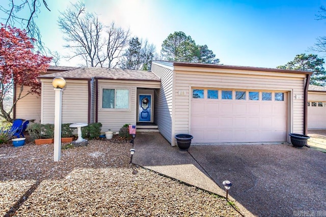 ranch-style home featuring a garage