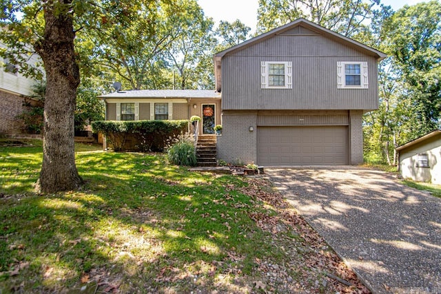 split level home featuring a front yard and a garage