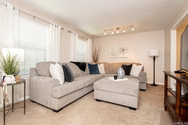 carpeted living room with a textured ceiling