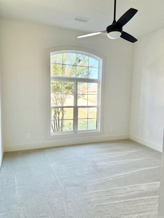 bedroom with ceiling fan and light colored carpet