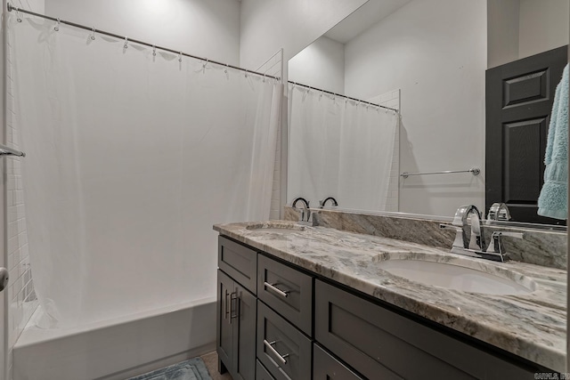 bathroom featuring vanity and shower / bath combo with shower curtain