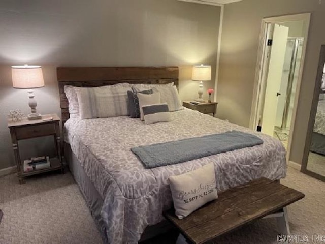 carpeted bedroom featuring connected bathroom