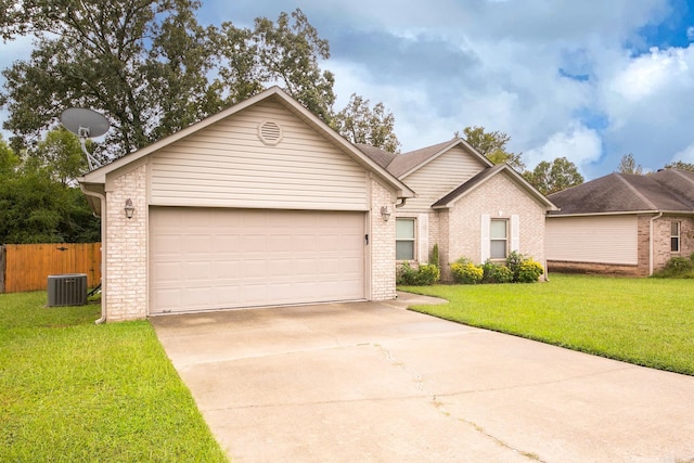 ranch-style house featuring a garage, a front lawn, and central AC unit