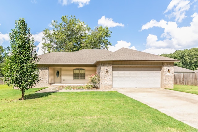 ranch-style house featuring a garage and a front lawn