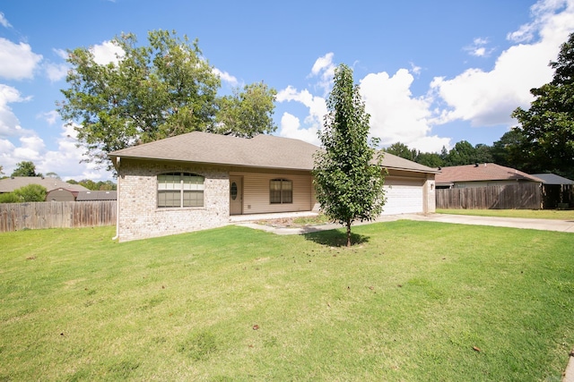 ranch-style home featuring a front lawn and a garage