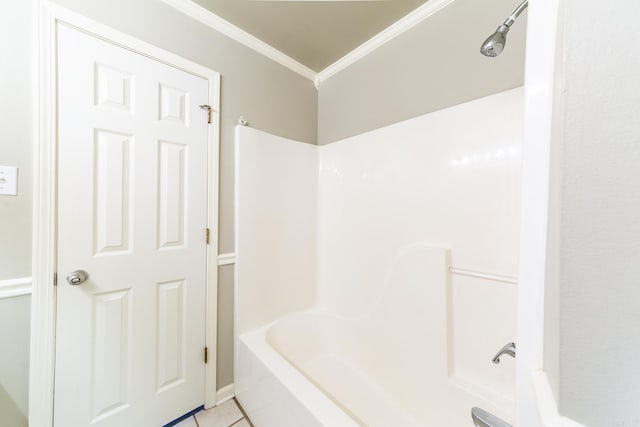 bathroom with tub / shower combination, crown molding, and tile patterned floors