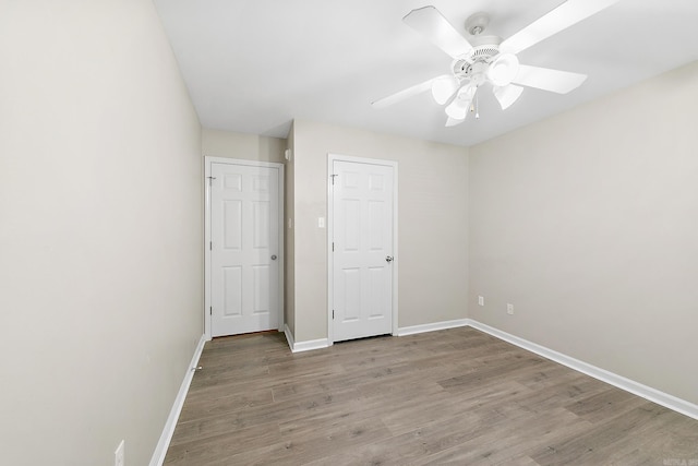 unfurnished bedroom featuring ceiling fan and light hardwood / wood-style floors