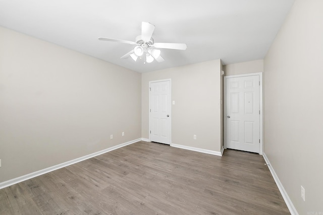 interior space with ceiling fan and hardwood / wood-style floors