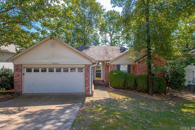 single story home with a garage and central AC