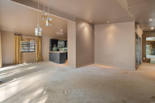 unfurnished living room featuring light colored carpet