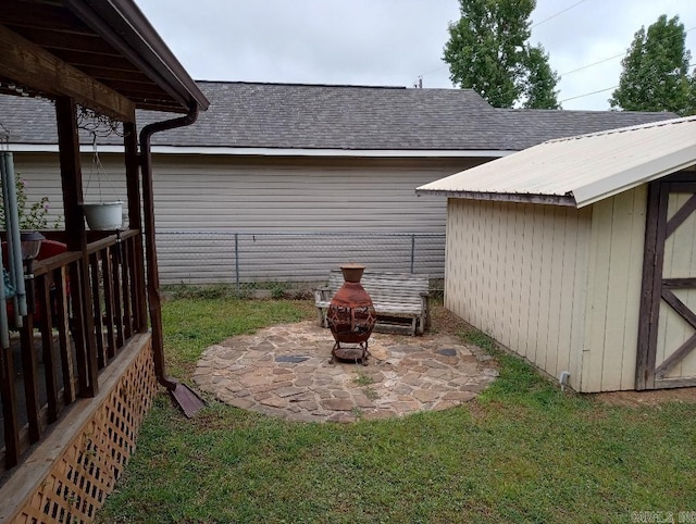 view of yard featuring a fire pit and a patio