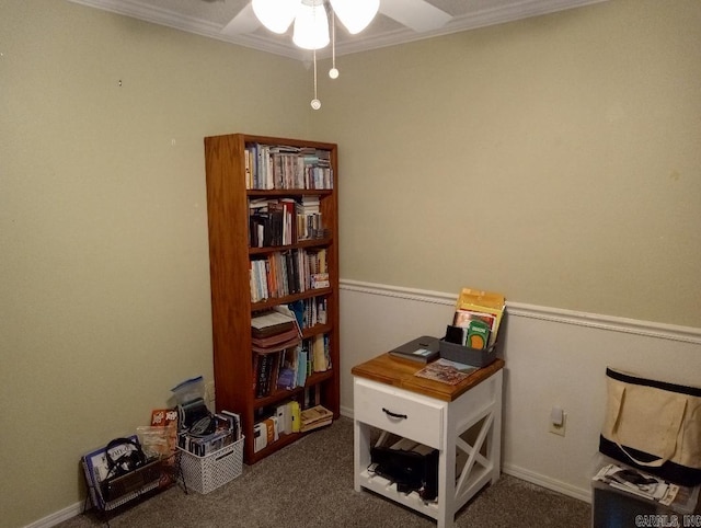 miscellaneous room with ceiling fan, crown molding, and dark colored carpet