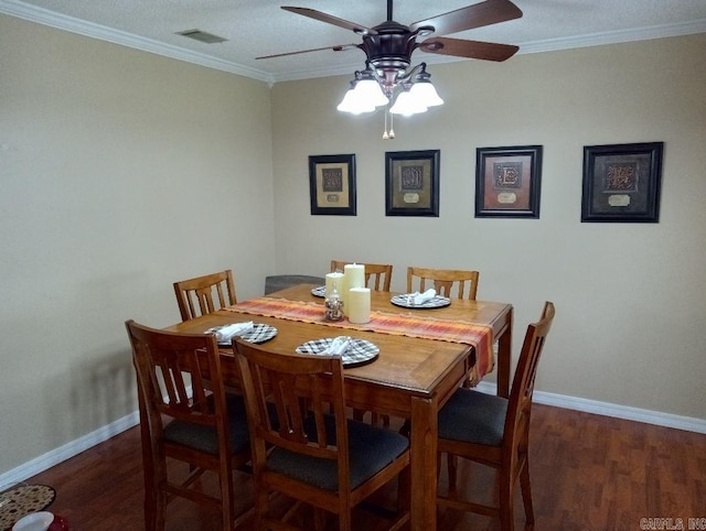 dining space with ceiling fan, dark hardwood / wood-style floors, and crown molding