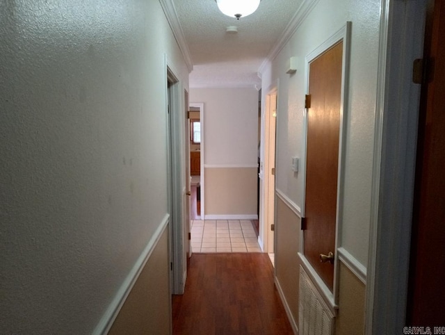 hall featuring light wood-type flooring and ornamental molding