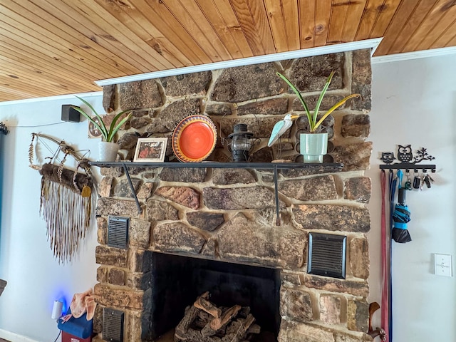 interior details featuring crown molding, a fireplace, and wood ceiling