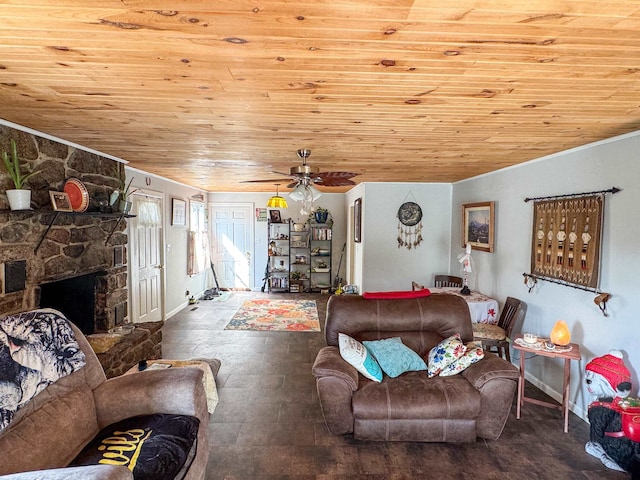 living room featuring ceiling fan, a stone fireplace, and wood ceiling