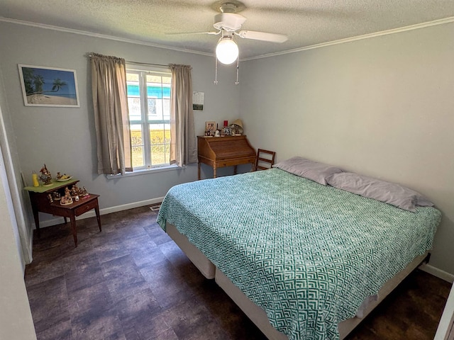 bedroom featuring a textured ceiling, ceiling fan, and crown molding