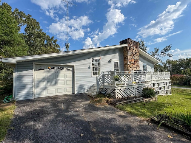 view of front of property with a deck and a front yard