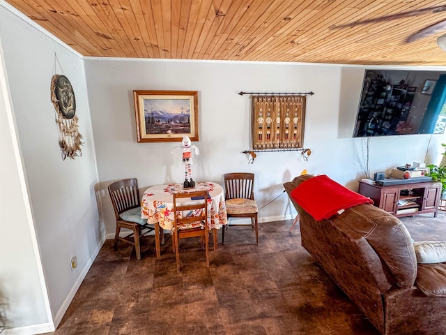 interior space featuring ceiling fan and wooden ceiling