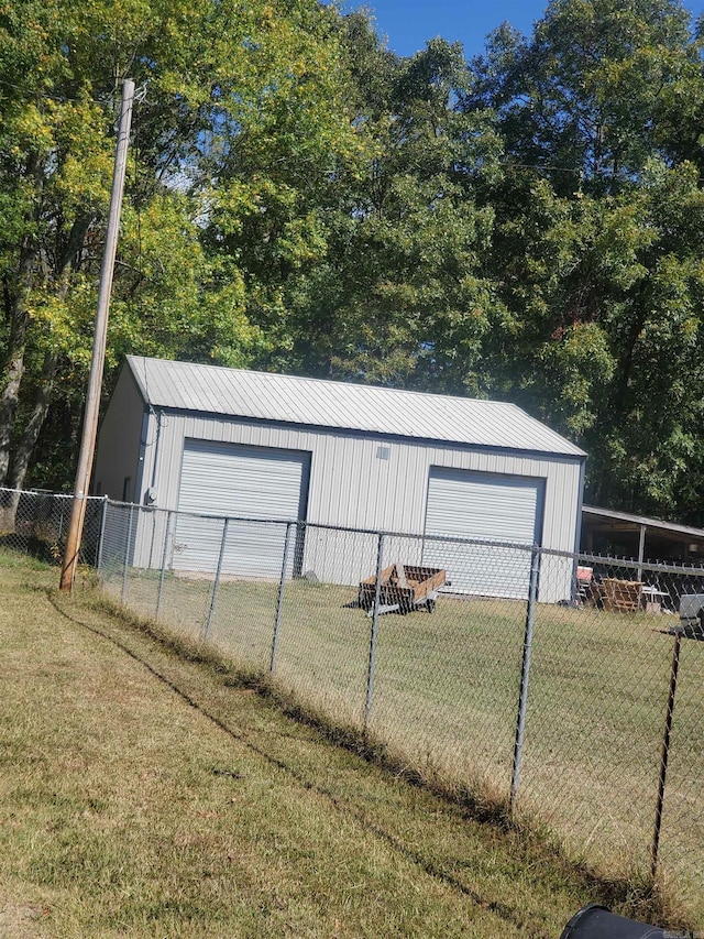 garage with a yard