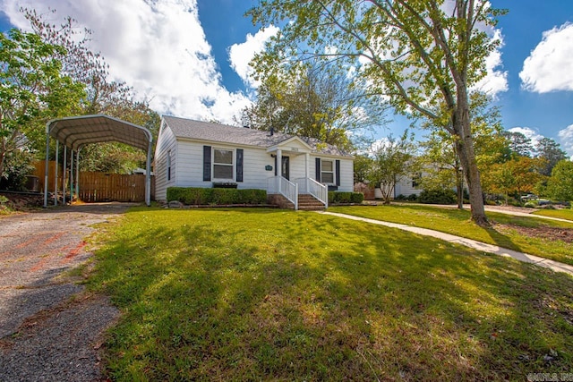 view of front of home featuring a front yard and a carport