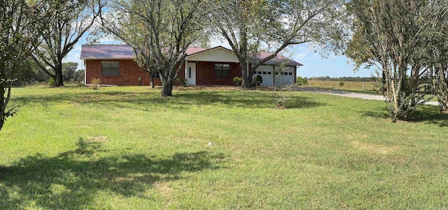 view of yard featuring a garage