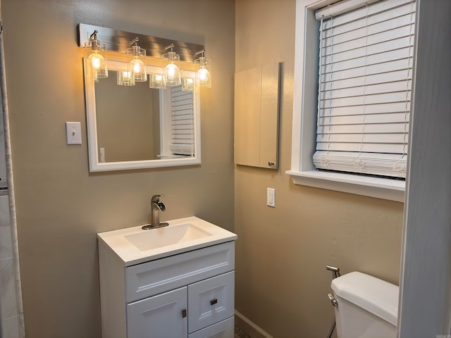 bathroom with vanity and toilet