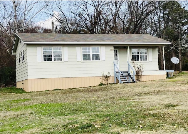 view of front of home with a front yard