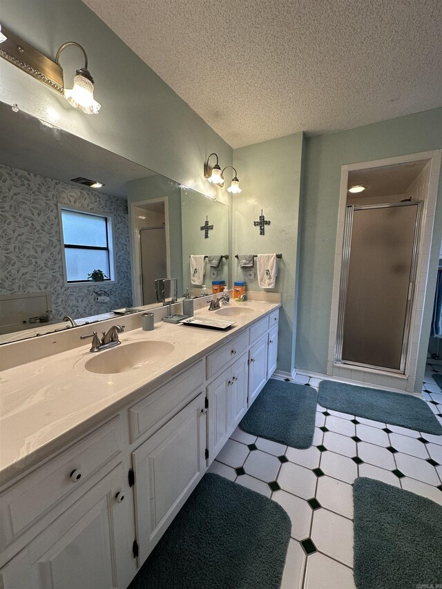3409 Ramsgate, Fort Smith, AR 72908 - full bathroom featuring wallpapered walls, a sink, a stall shower, and a textured ceiling