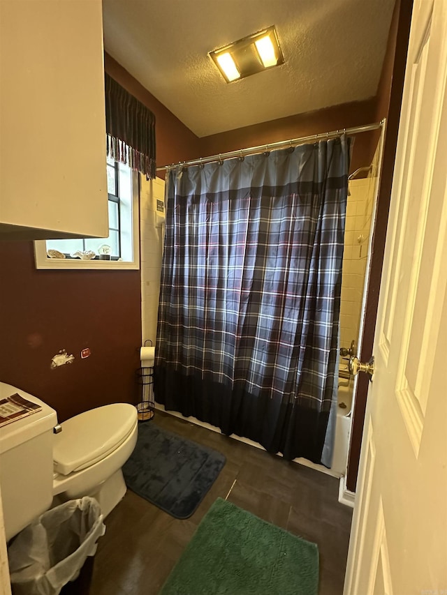 3409 Ramsgate, Fort Smith, AR 72908 - full bathroom featuring a textured ceiling, toilet, and shower / bath combination with curtain