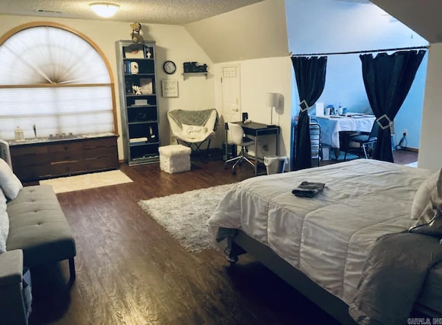 3409 Ramsgate, Fort Smith, AR 72908 - bedroom featuring wood finished floors, lofted ceiling, and a textured ceiling