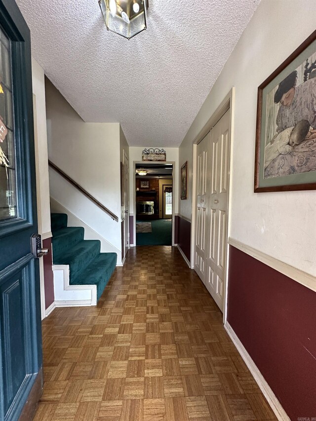 3409 Ramsgate, Fort Smith, AR 72908 - corridor featuring baseboards, stairway, and a textured ceiling