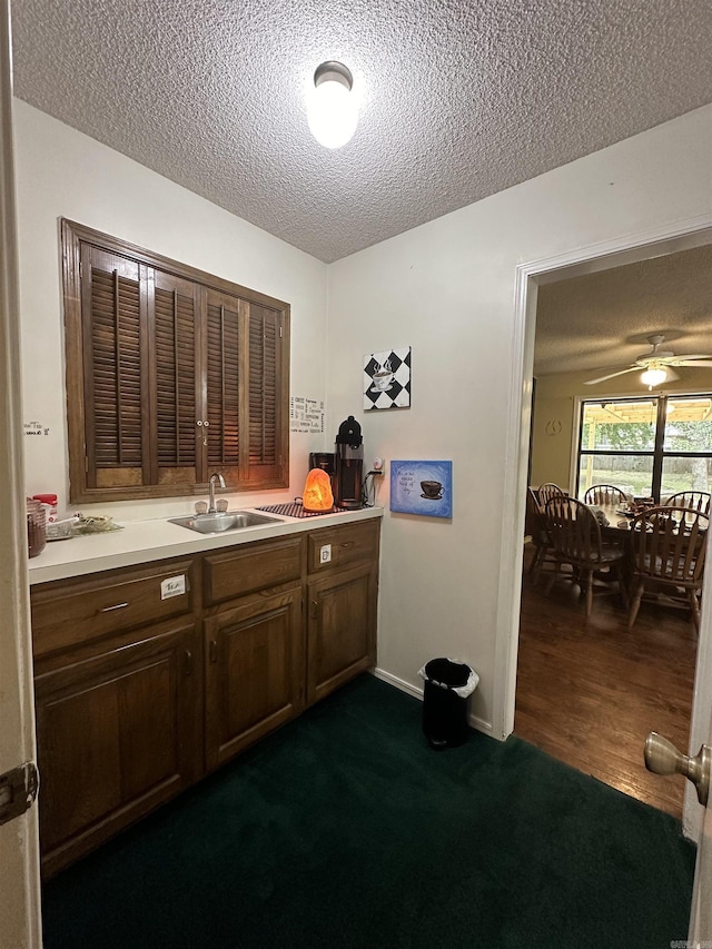 3409 Ramsgate, Fort Smith, AR 72908 - bar featuring baseboards, a ceiling fan, a sink, and a textured ceiling