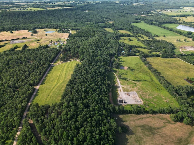 drone / aerial view featuring a water view and a rural view