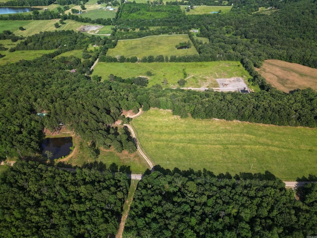 birds eye view of property featuring a water view and a rural view