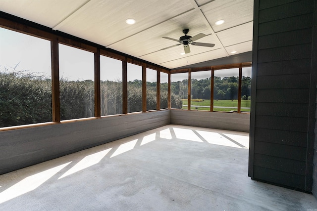 unfurnished sunroom featuring ceiling fan