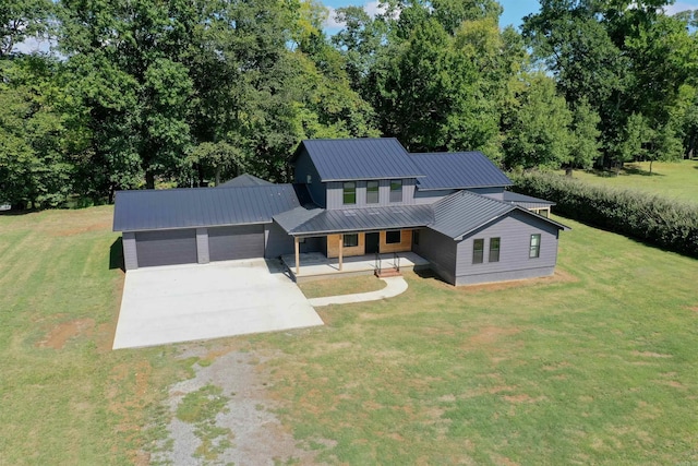 view of front of property with a front yard and a garage