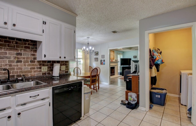 kitchen featuring white cabinets, backsplash, black dishwasher, pendant lighting, and an inviting chandelier