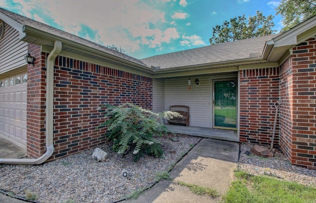 entrance to property featuring a garage