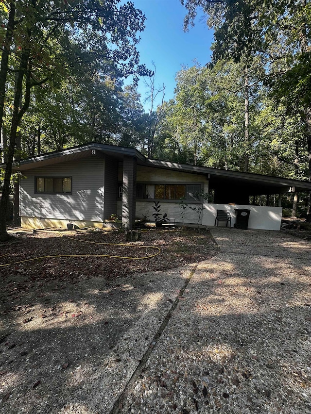 view of front of property with a carport