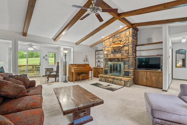 carpeted living room with beamed ceiling, ceiling fan, high vaulted ceiling, and a fireplace